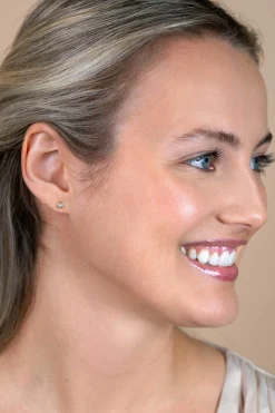 4mm ZINZI Gold 14 krt gouden oorknoppen ronde zetting bezet met witte zirconia ZGO451