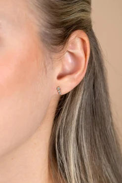 7mm ZINZI Gold 14 krt gouden oorstekers bezet met een rij aan ronde witte zirkonia's ZGO556