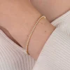 ZINZI gold plated zilveren tennisarmband 2,4mm breed bezet met een rij glanzende witte parels ZIA2910