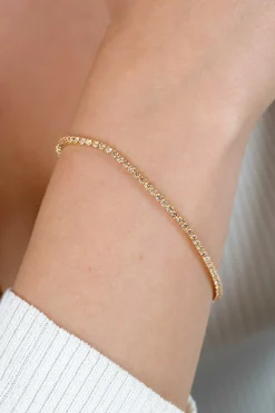 ZINZI gold plated zilveren tennis armband 2,1mm breed met rijzetting champagnekleurige zirconia's ZIA2892C