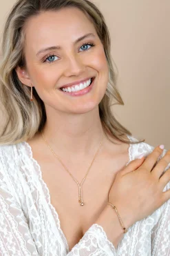 ZINZI gold plated zilveren Y-collier 45cm met luxe tennislook en champagnekleurige zirkonia's in rijzetting met twee grotere donkerbruine kleurstenen ZIC2894C