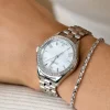 ZINZI Tresor horloge 32mm bezet met witte zirkonia's, parelmoer wijzerplaat en zilverkleurige stalen kast en schakelband ZIW2417
