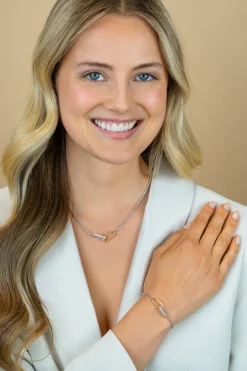 ZINZI zilveren schakelketting met twee verbonden ovale schakels: één gold plated, de ander bezet met witte zirkonia's 42-45cm ZIC2758